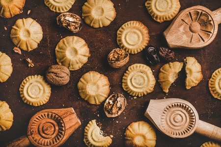 Flat lay of Turkish traditional Hatay semolina cookies with walnut filling