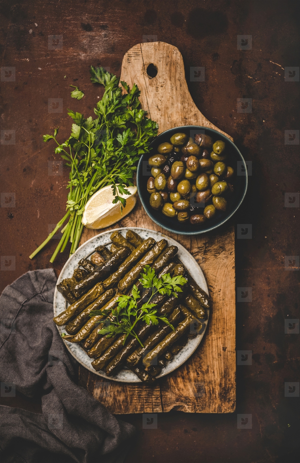 Flat lay of traditional turkish Dolma meze or snack on board