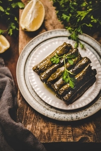 Turkish traditional Dolma with rice and spices over wooden background