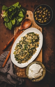 Flat lay of Turkish traditional dish Bulgur and spinach