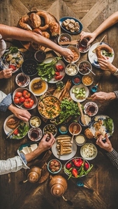 Flat lay of Turkish family eating traditional Middle Eastern breakfast