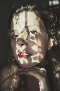 Artistic portrait of a young woman with retro shadow play style