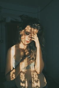 Artistic portrait of a young woman with retro shadow play style