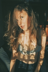 Shadowplay portrait of a young and confidence woman