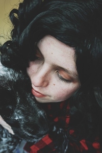 Cute shot of a young woman spending time with her dog