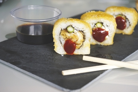 Fushion food of cooked and hot chicken sushi