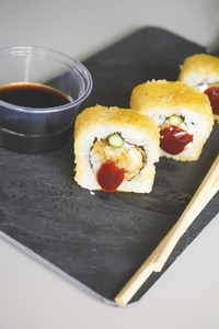 Fusion food of cooked and hot chicken sushi