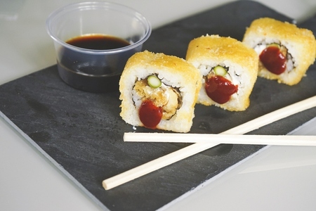 Fusion food of cooked and hot chicken sushi