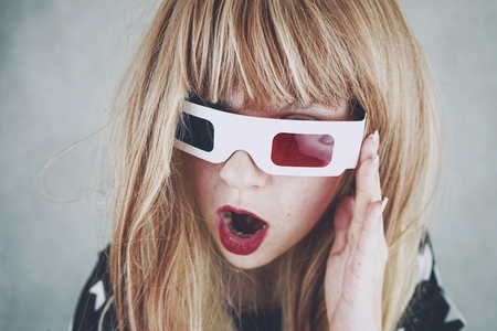 Young woman wearing vintage 3D glasses