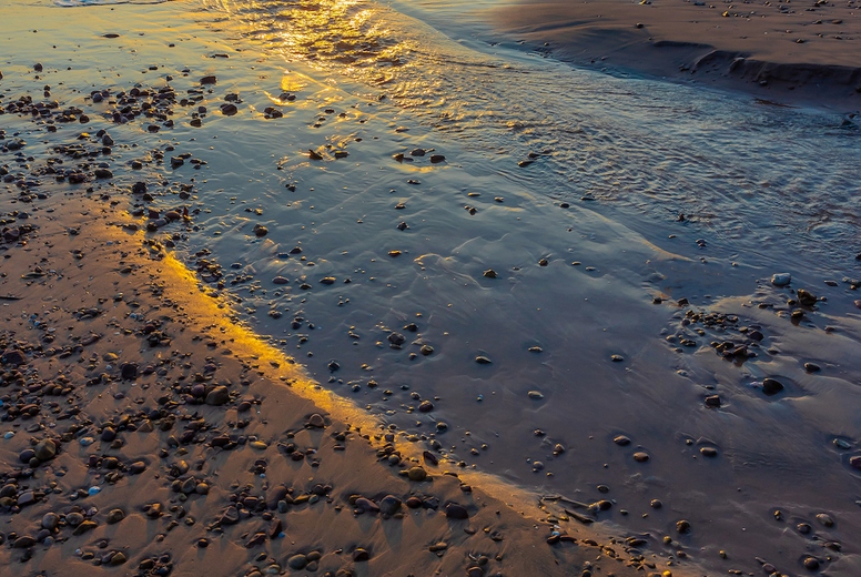 Beautiful sea waves in the morning sunrise.