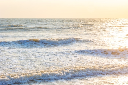 Beautiful sea waves in the morning sunrise