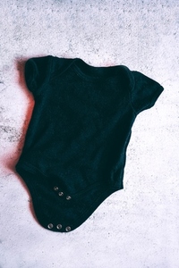 Cool and grunge mockup of a black baby body