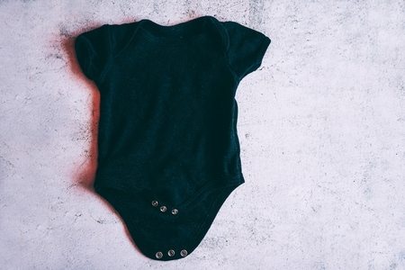 Cool and grunge mockup of a black baby body