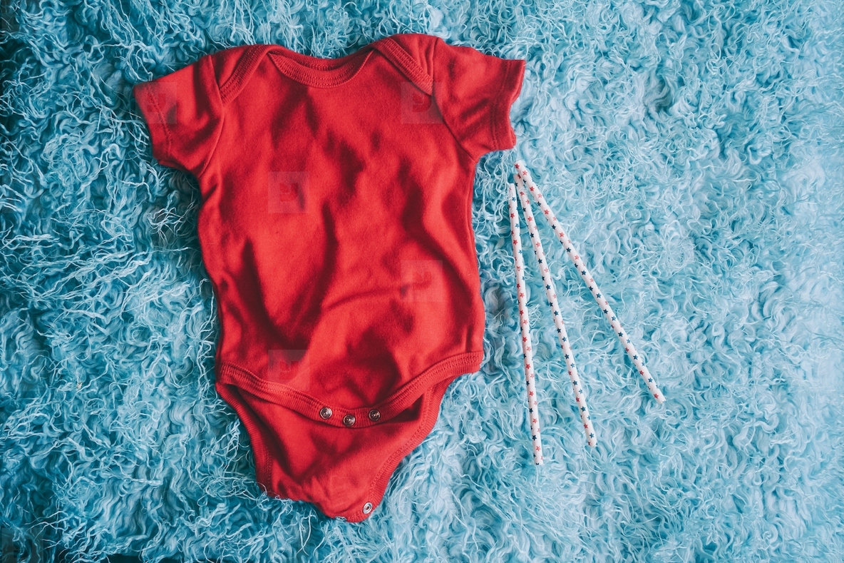 Red baby body against soft background