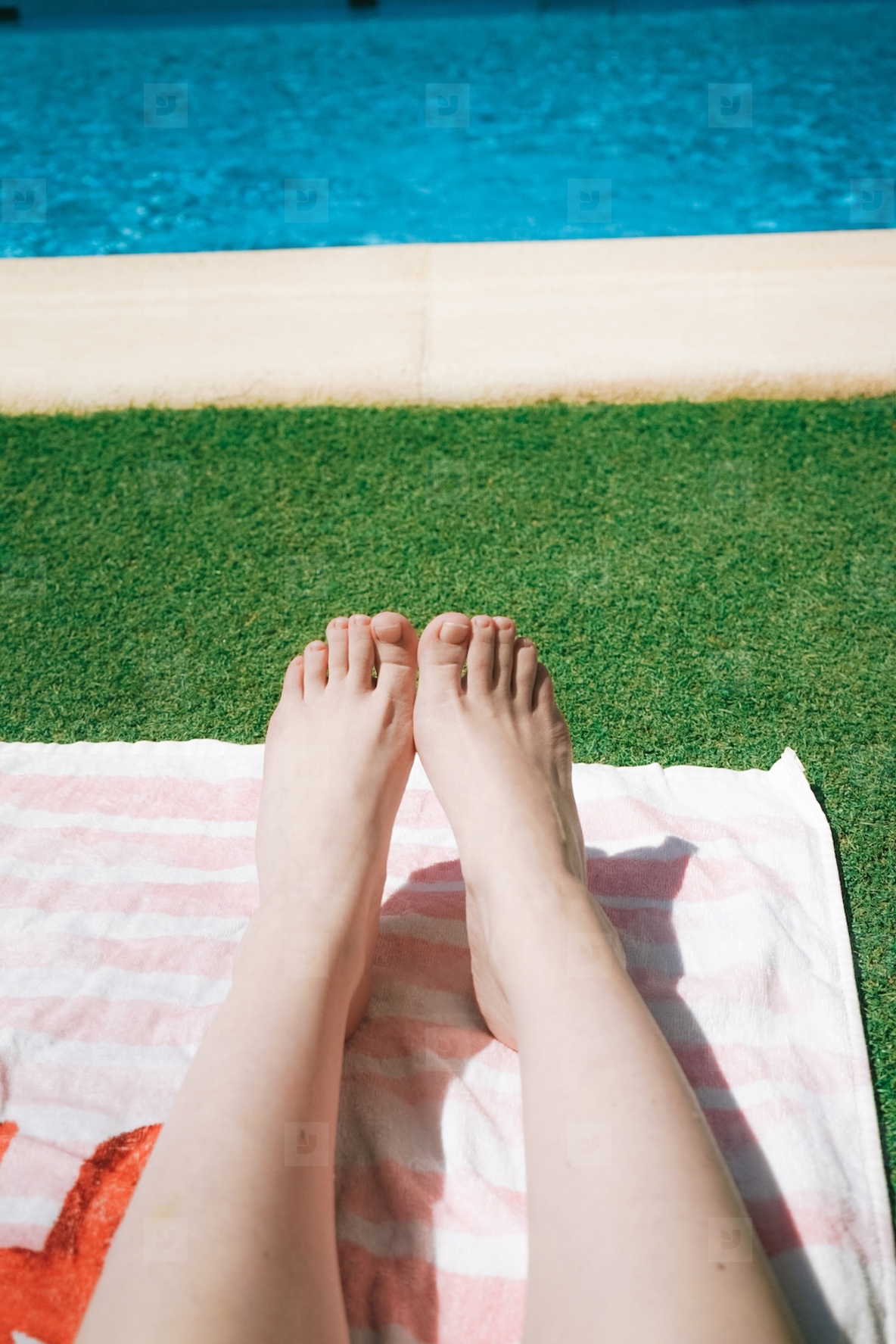 Feet and legs of a woman in a swimming pool