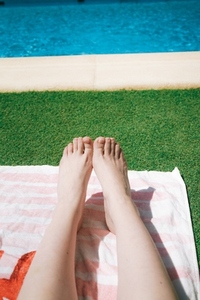 Feet and legs of a woman in a swimming pool