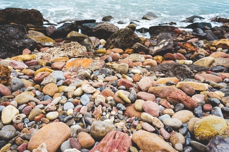 Variety of stones in a stone shore in the coast
