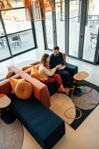 High angle view of two businesspeople working in a lobby