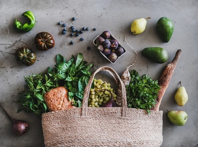 Flat lay of eco friendly bag with fresh produce  bread and sausage