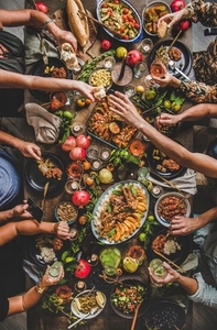 Flat lay of people feasting with Turkish cuisine foods