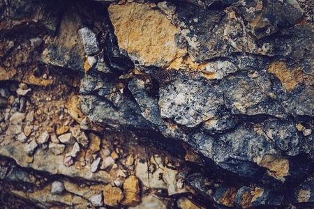 Grunge texture of wild stones in nature