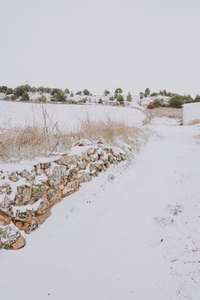 Snowy path in a quiet scene of a deserted villaje in Spain
