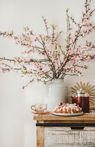 Rose almond bundt cake and tea under almond blooming branches