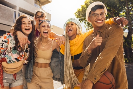 Group of gen z friends laughing together