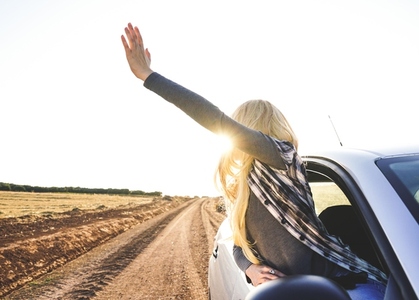 Young woman in a road trip enjoying the journey