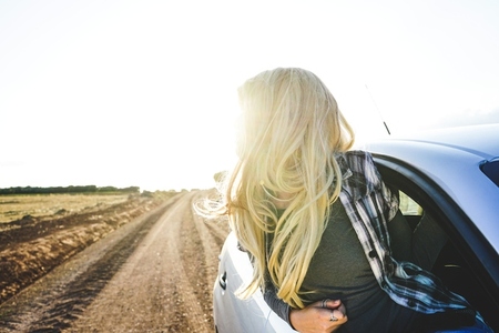 Young woman in a road trip enjoying the journey