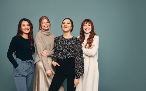 Diverse women smiling cheerfully in a studio