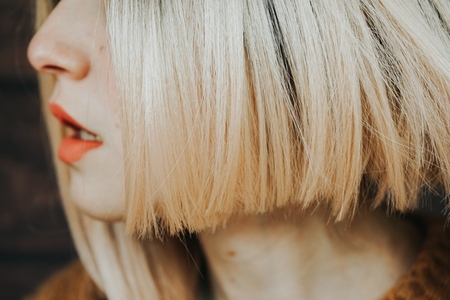 Close up of the hair and lips of a young woman