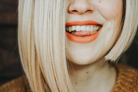 Close up of the hair and lips of a young woman