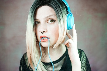 Young modern woman listening to music