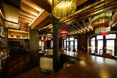 Interior of modern restaurant with wooden furniture