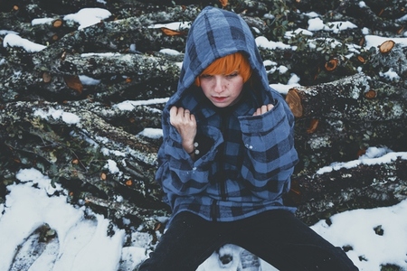 Redhead androgynous model in a winter scene