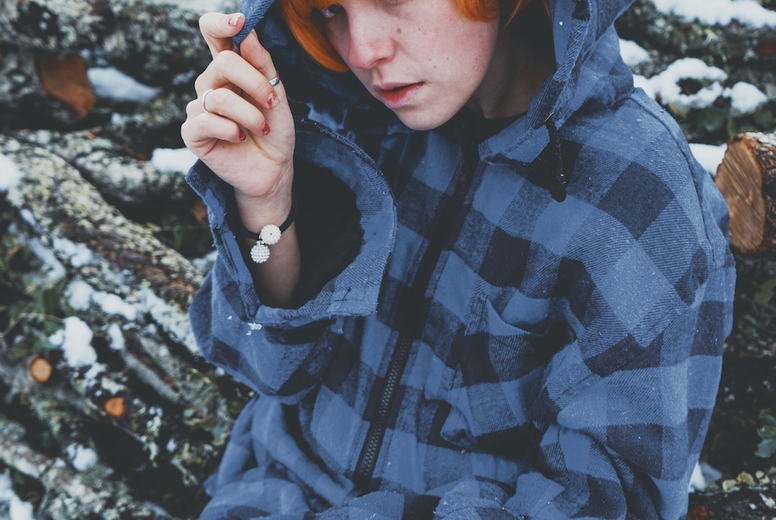 Redhead androgynous model in a winter scene