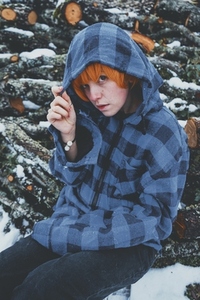Redhead androgynous model in a winter scene