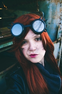 Young woman wearing steampunk style clothes