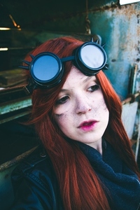 Young woman wearing steampunk style clothes