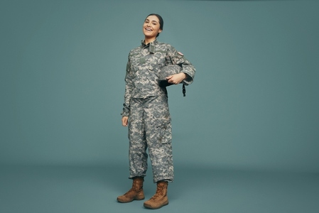 United States servicewoman smiling happily in a studio