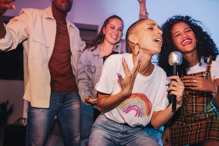 Woman singing her heart out on karaoke night