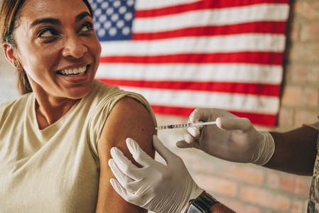 United States servicewoman receiving the covid 19 vaccine