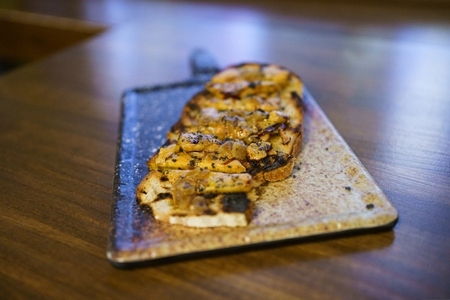 Cut toast of foie served on board