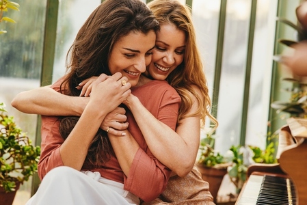 Woman embracing her best friend warmly