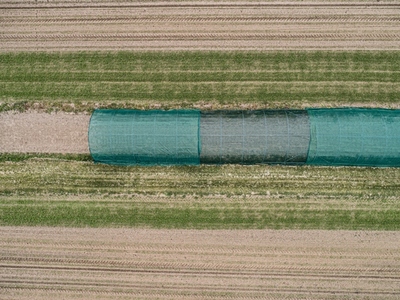 Aerial view green polyethylene tunnels over plants Germany