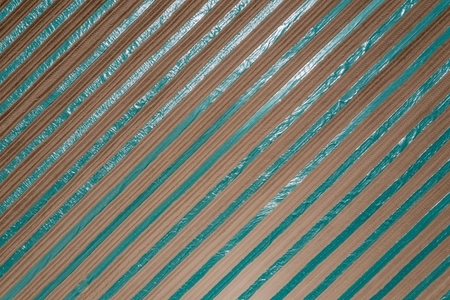 Aerial view from above rows of hay forming stripe pattern France