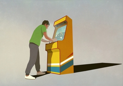 Boy playing video games at retro machine