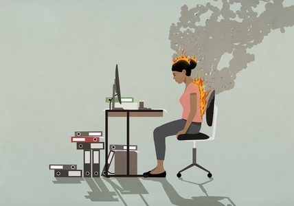 Businesswoman sitting at desk with back and head burning