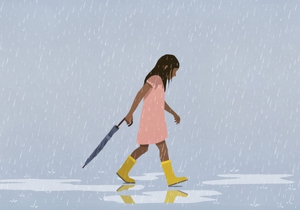 Girl carrying closed umbrella in rain